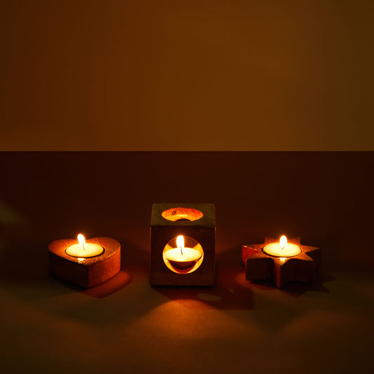 wooden tealight holder, different shapes holder, diwali decor, christams decor, set of three, front view with three candles.