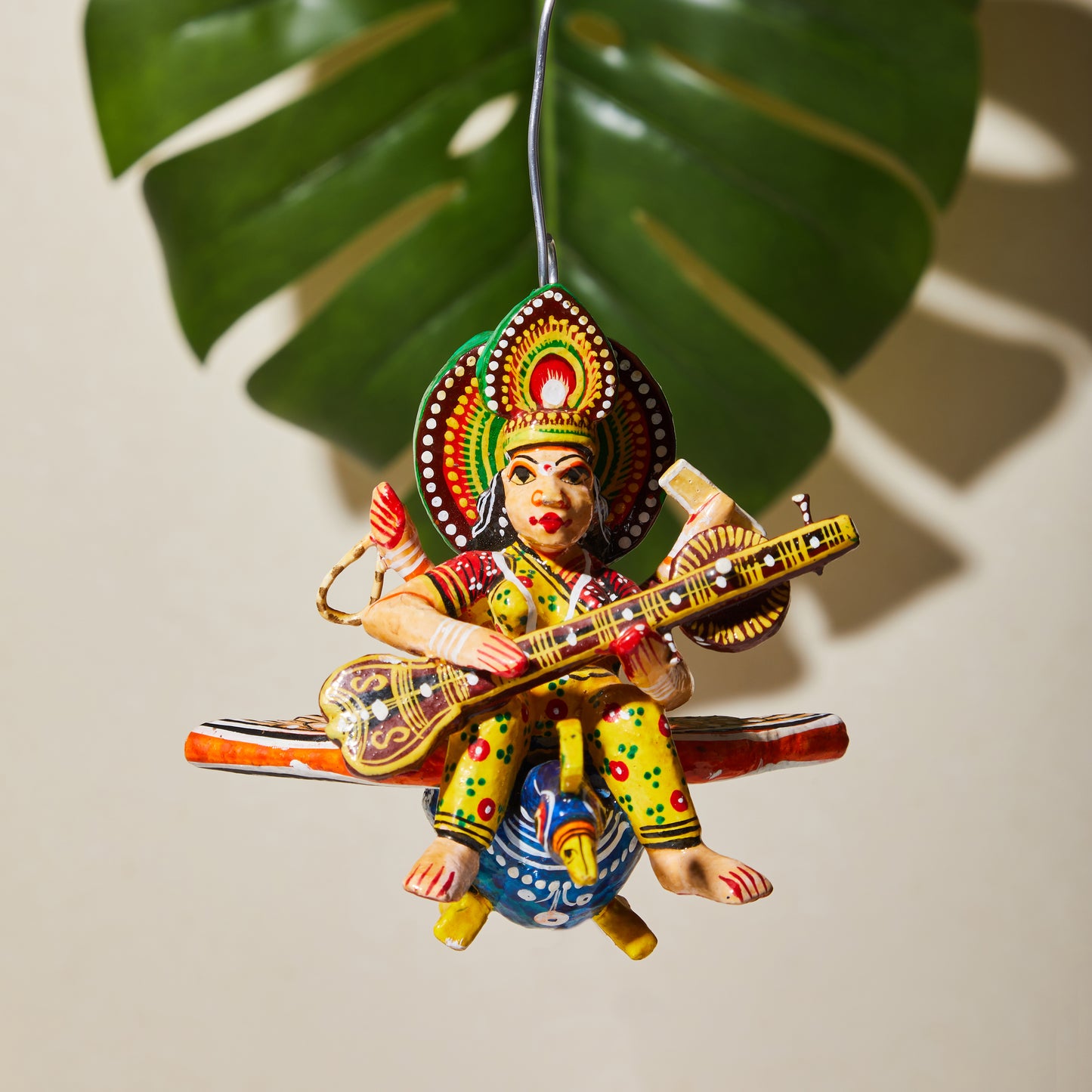 Flying Gods of Varanasi – Saraswati riding on a Peacock